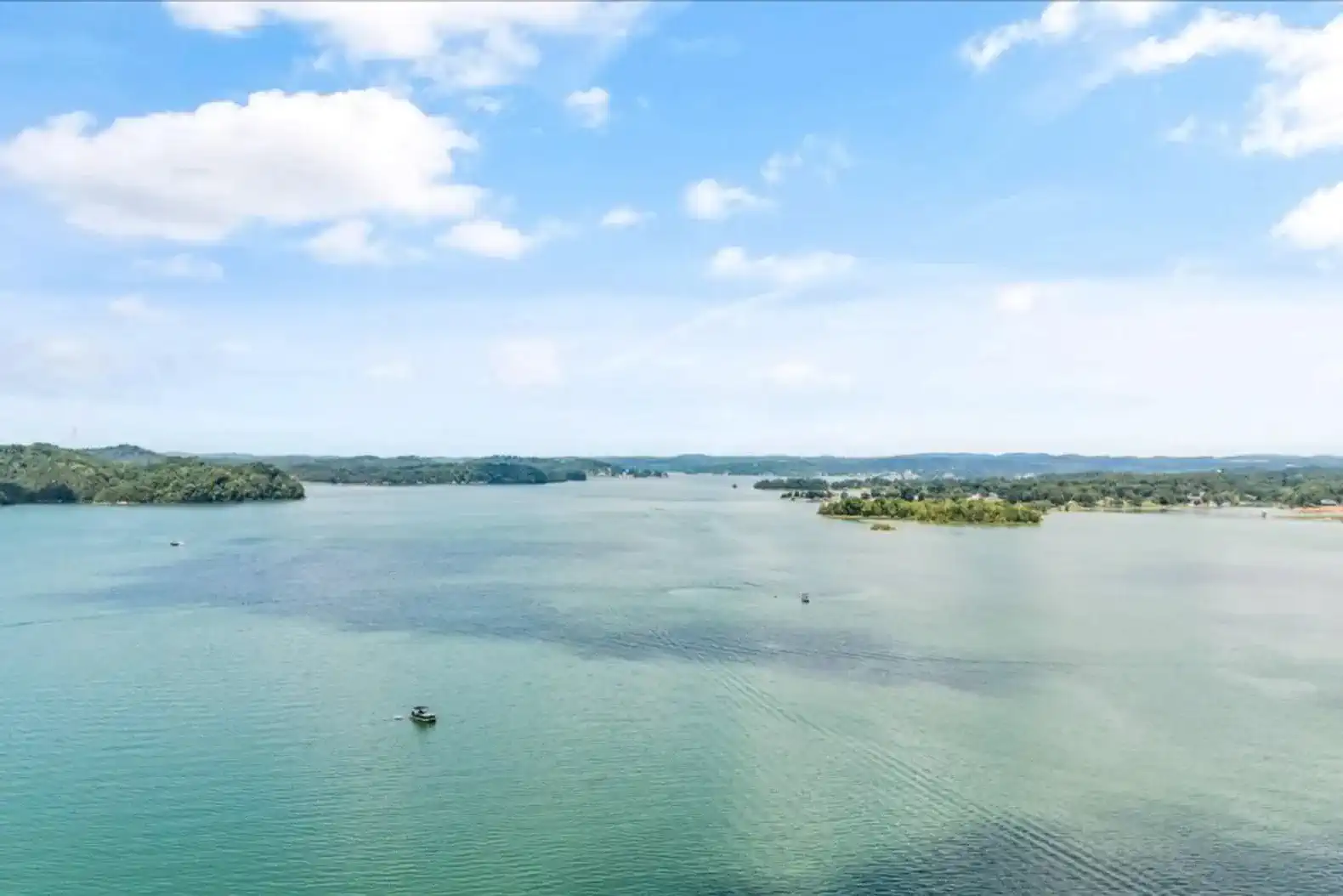 Scenic view of Lake Douglas with clear blue waters and distant islands