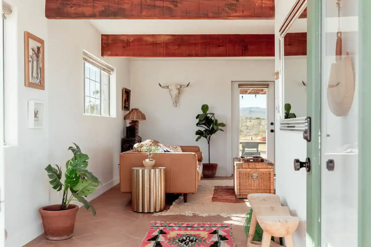 Cozy living room with a sofa, plants, and decorative elements
