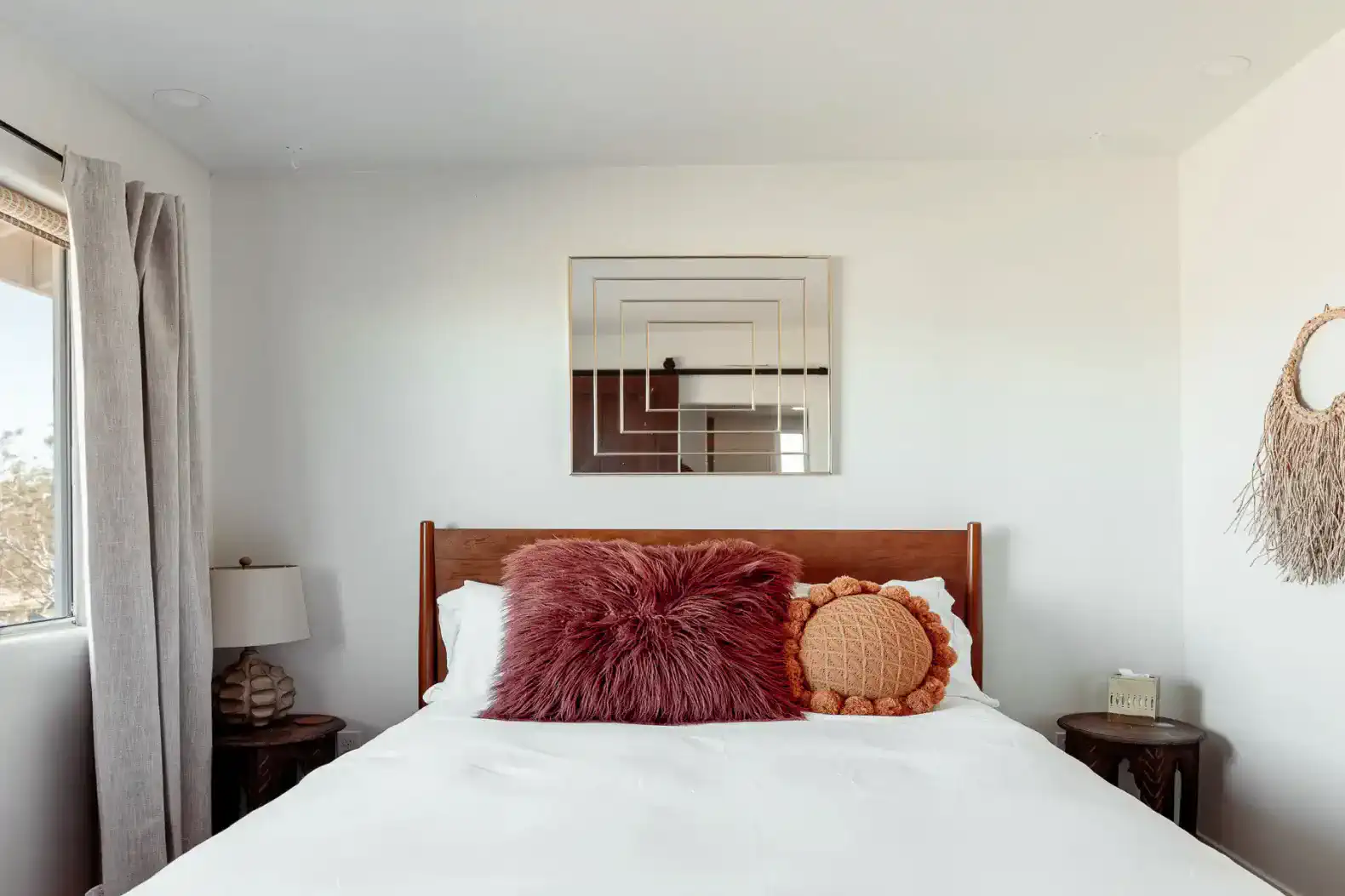 Cozy master bedroom with a plush bed and decorative pillows