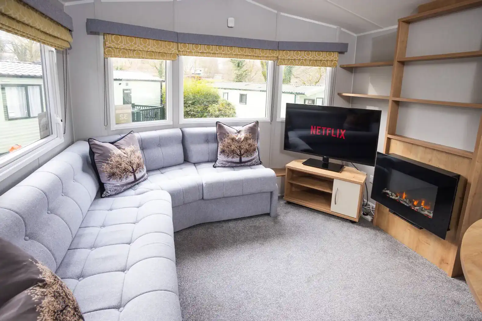 Unwind in our cosy living area, designed for ultimate relaxation after a day of exploring the Lake District. Relax on the sofa and watch TV in the warm glow of the electric fireplace