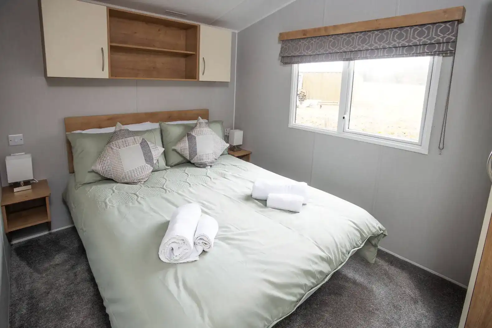 Settle into a comfortable double bed topped with premium linens for the ultimate night's sleep. Enjoy a clutter-free, relaxing sanctuary with a wardrobe and drawers to keep your space feeling like home