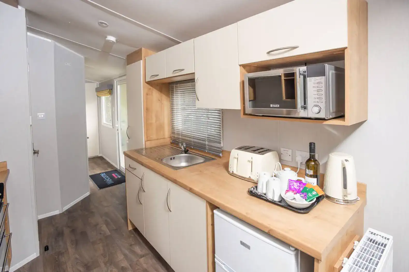 Our kitchen features a modern oven, cooker, microwave, and toaster, perfect for preparing meals. We provide basic condiments and essential amenities, so you have everything needed for a stress-free, self-catering stay