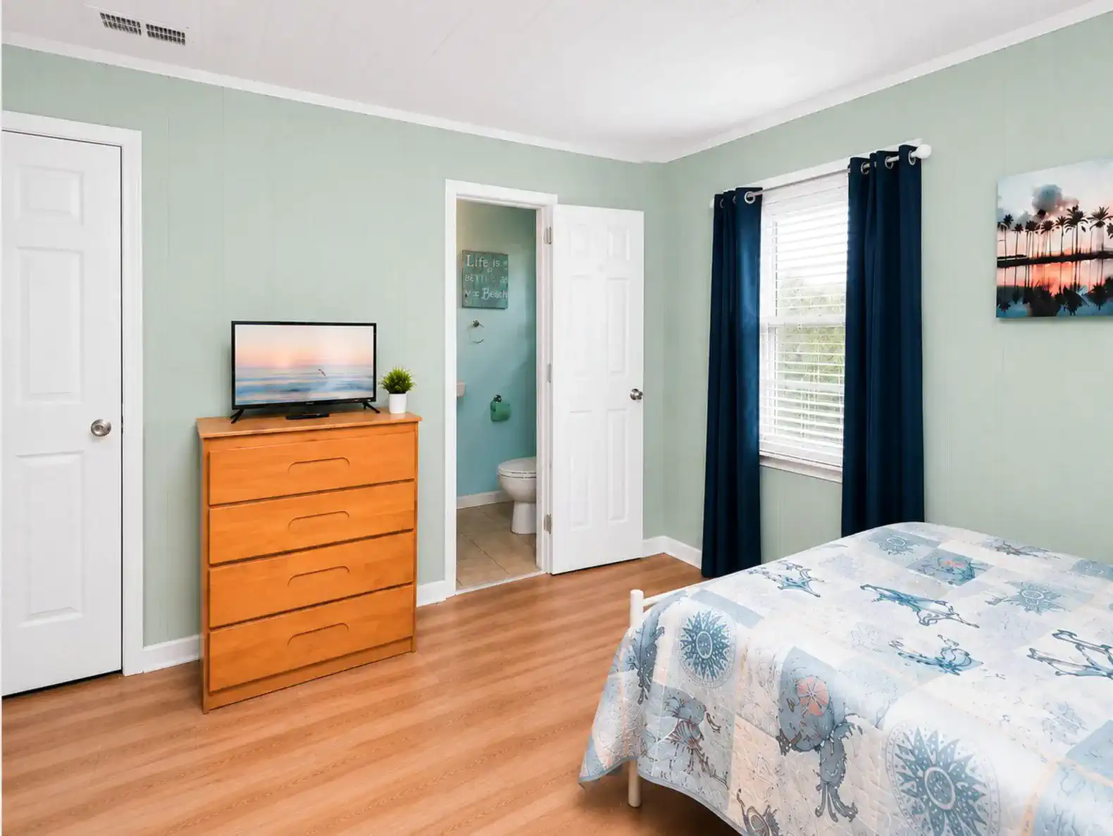 Anchors Up bedroom with two full beds and a bathroom