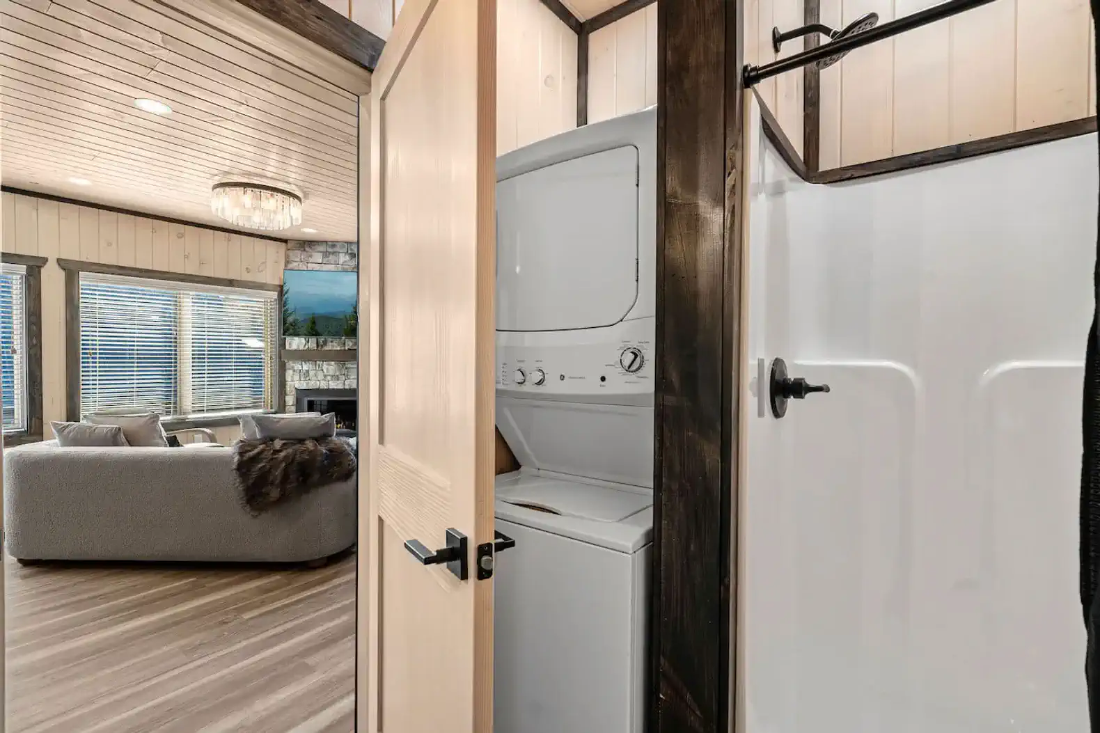 Stacked washer and dryer located in the full bathroom on the main level. 