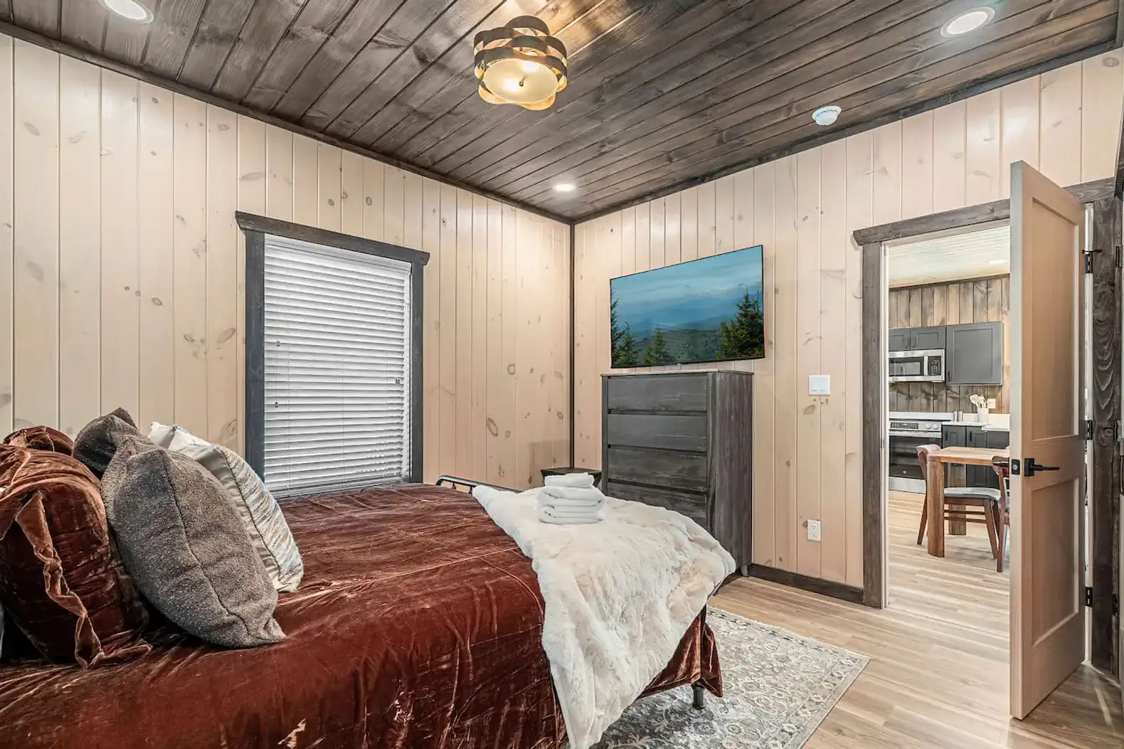 King suite on the main level with private ensuite full bathroom. Lots of space to store your things in either the closet and dresser so you can keep your stay organized. 