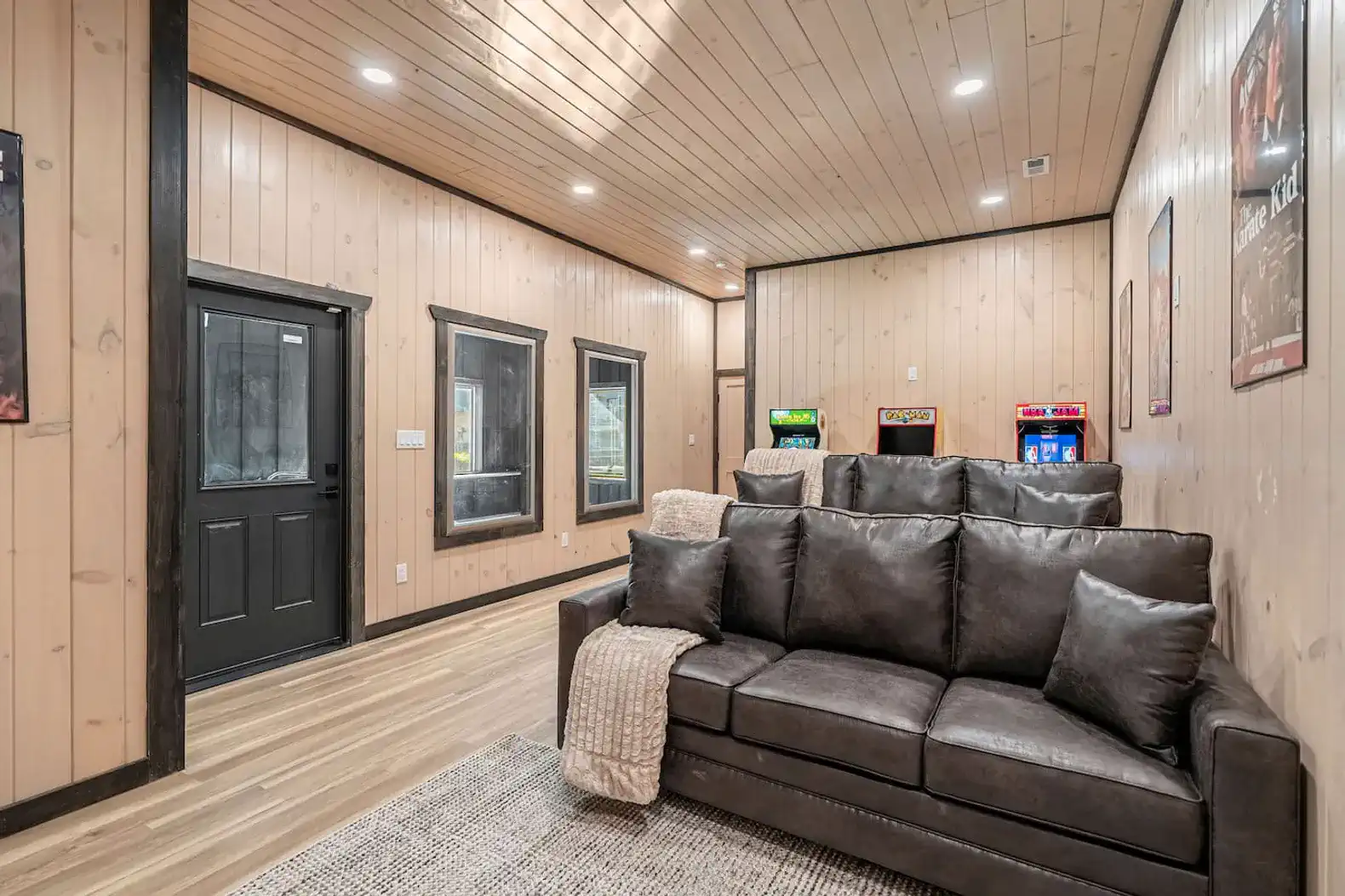 Lowest level entertainment space w/ movie seating and arcade games so you can entertain everyone at once!
