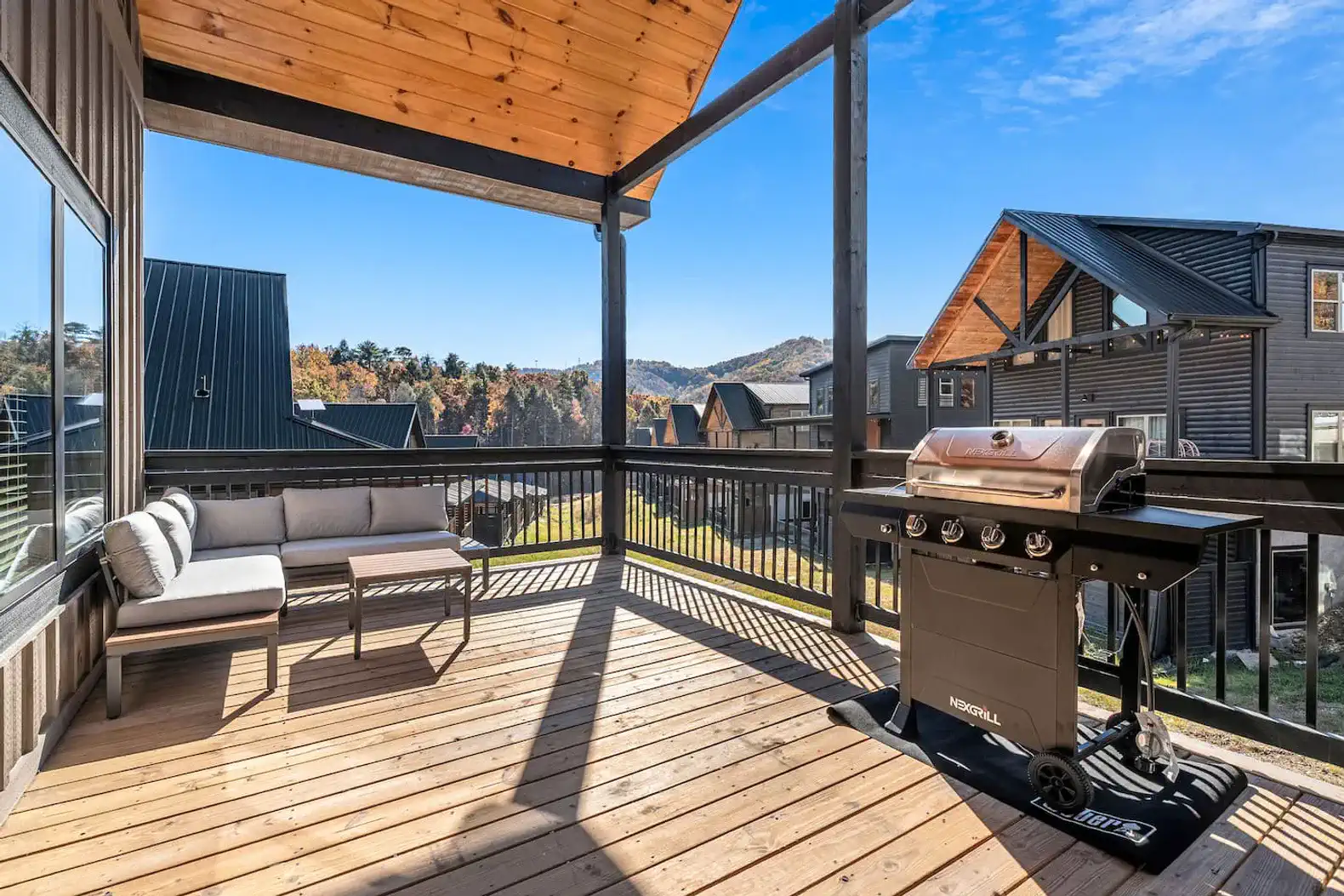 Back deck with seating and grill! Perfect for some summer BBQ and warm laughs. 