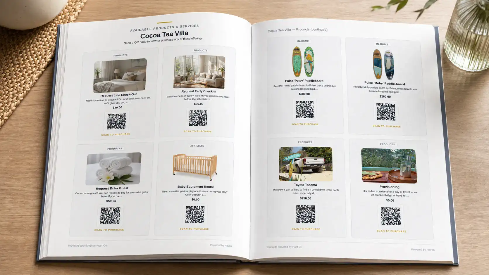 Printed welcome book opened to a page of Host Co product cards with QR codes