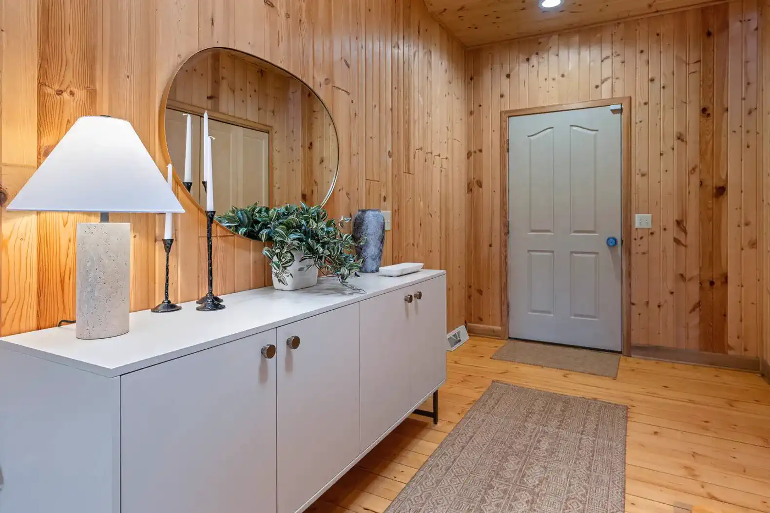 Welcoming entryway with space to settle in and store shoes and coats.