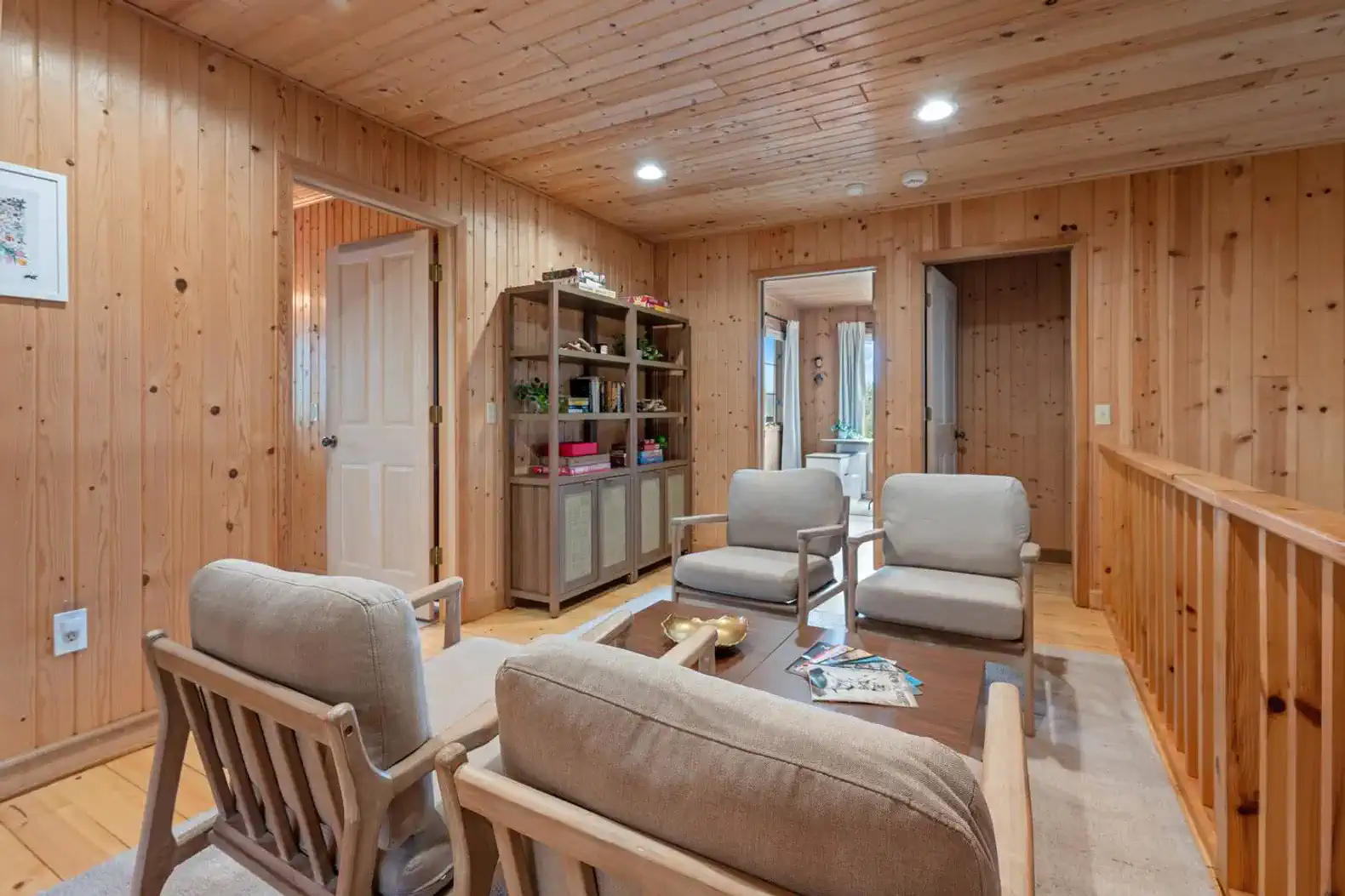Cozy conversation and game nook on the second-floor landing, overlooking the living room.
