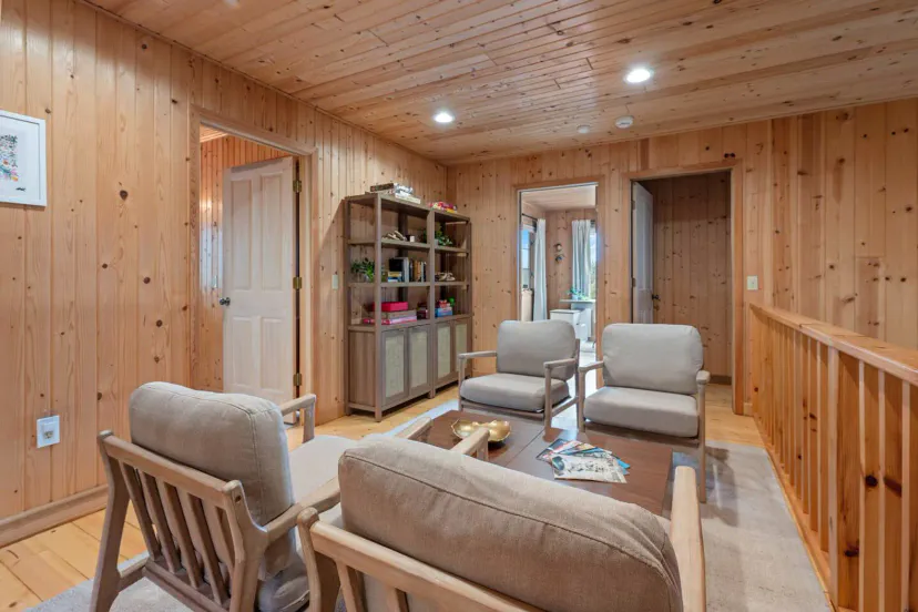 Cozy conversation and game nook on the second-floor landing, overlooking the living room.