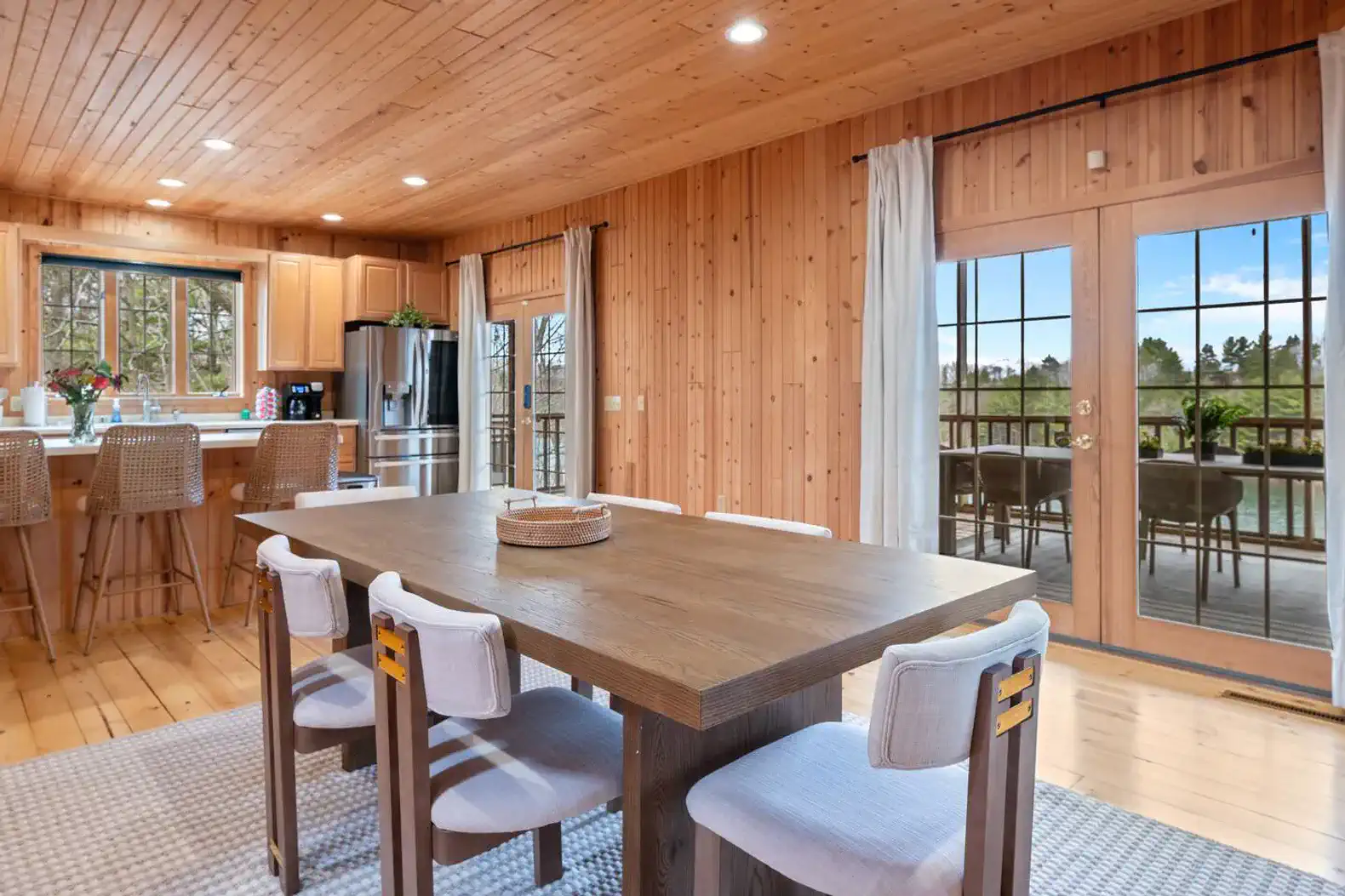 Indoor dining seats 6, with space for 8 more on the spacious screened-in porch.