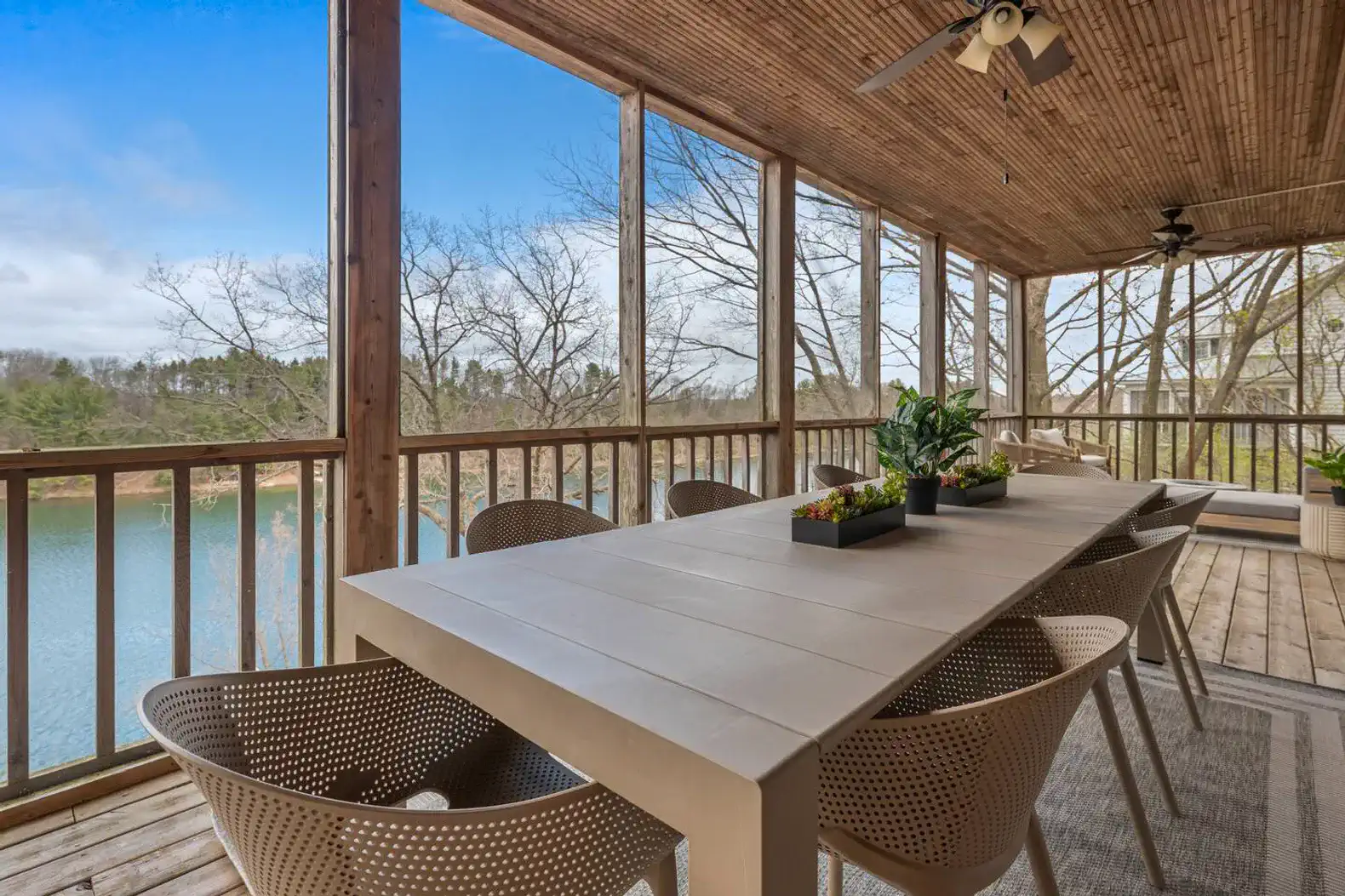 The main-level veranda is fully screened, allowing the family to enjoy meals surrounded by trees and scenic views—without the bother of bugs.