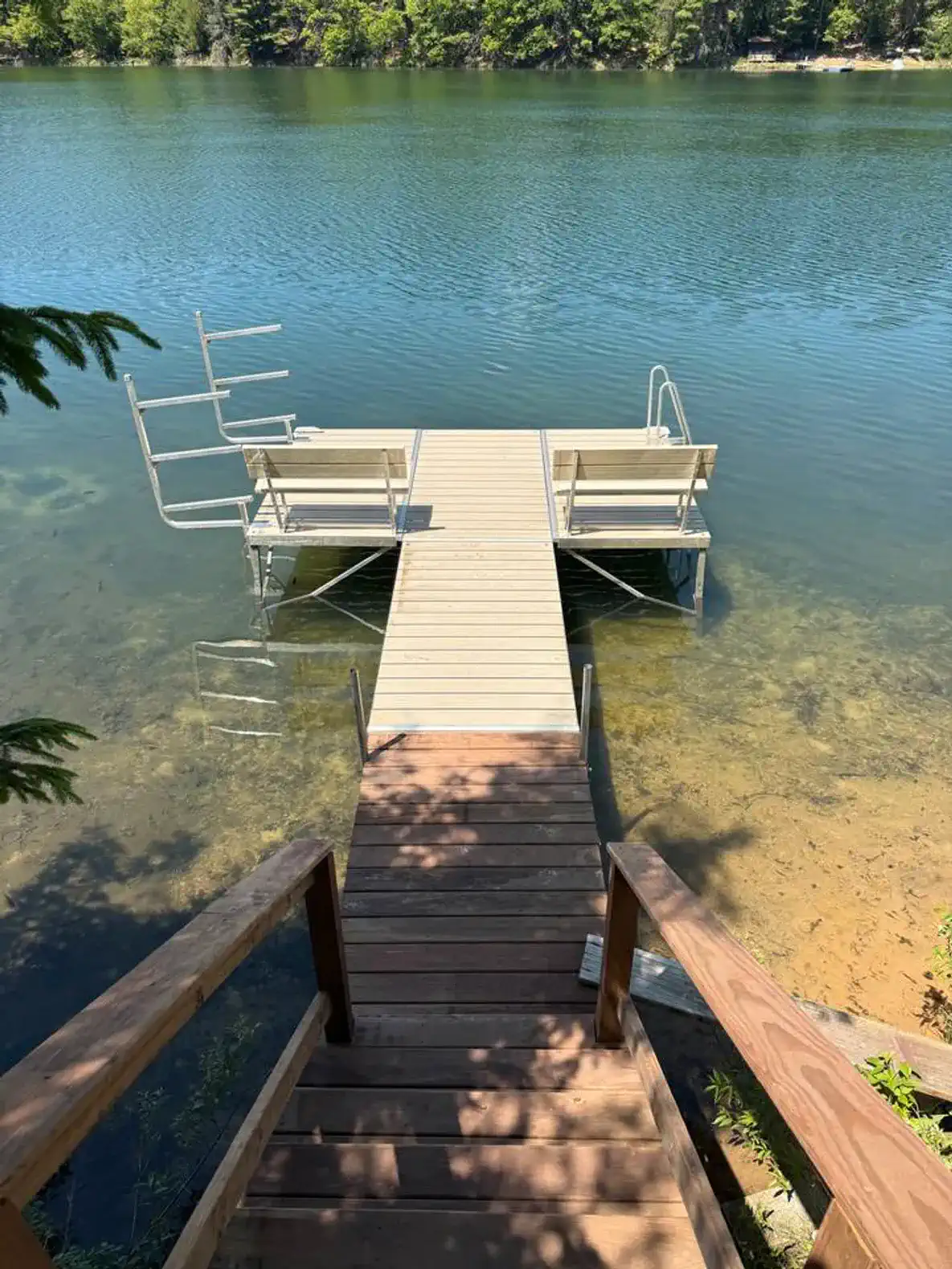 The pier is installed for summer 2026. We keep a few kayaks on the racks so you don’t have to carry them up and down the stairs. 
