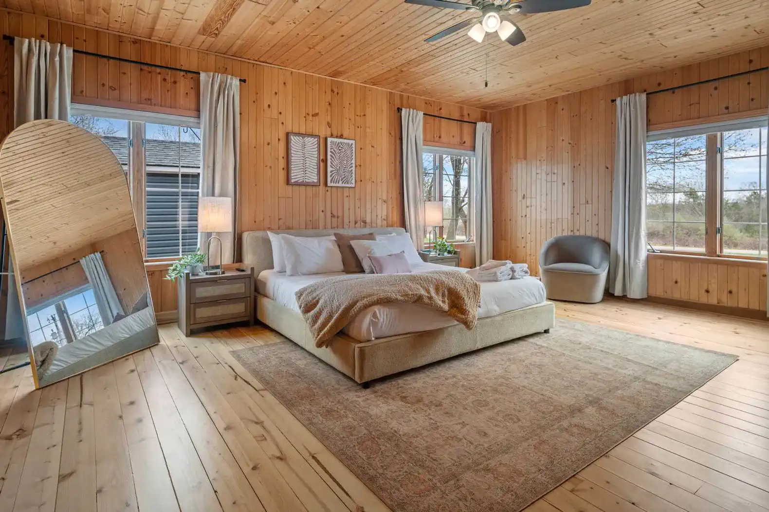 First-Floor Primary Suite: Spacious and inviting, this bedroom features a king bed, Smart TV, and a large double reach-in closet with hangers. Enjoy the privacy and convenience of your own full en suite bathroom.
