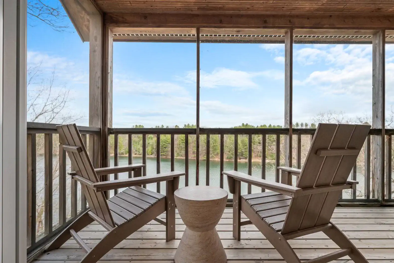 Private screened-in porch perched in the treetops, offering stunning panoramic views.
