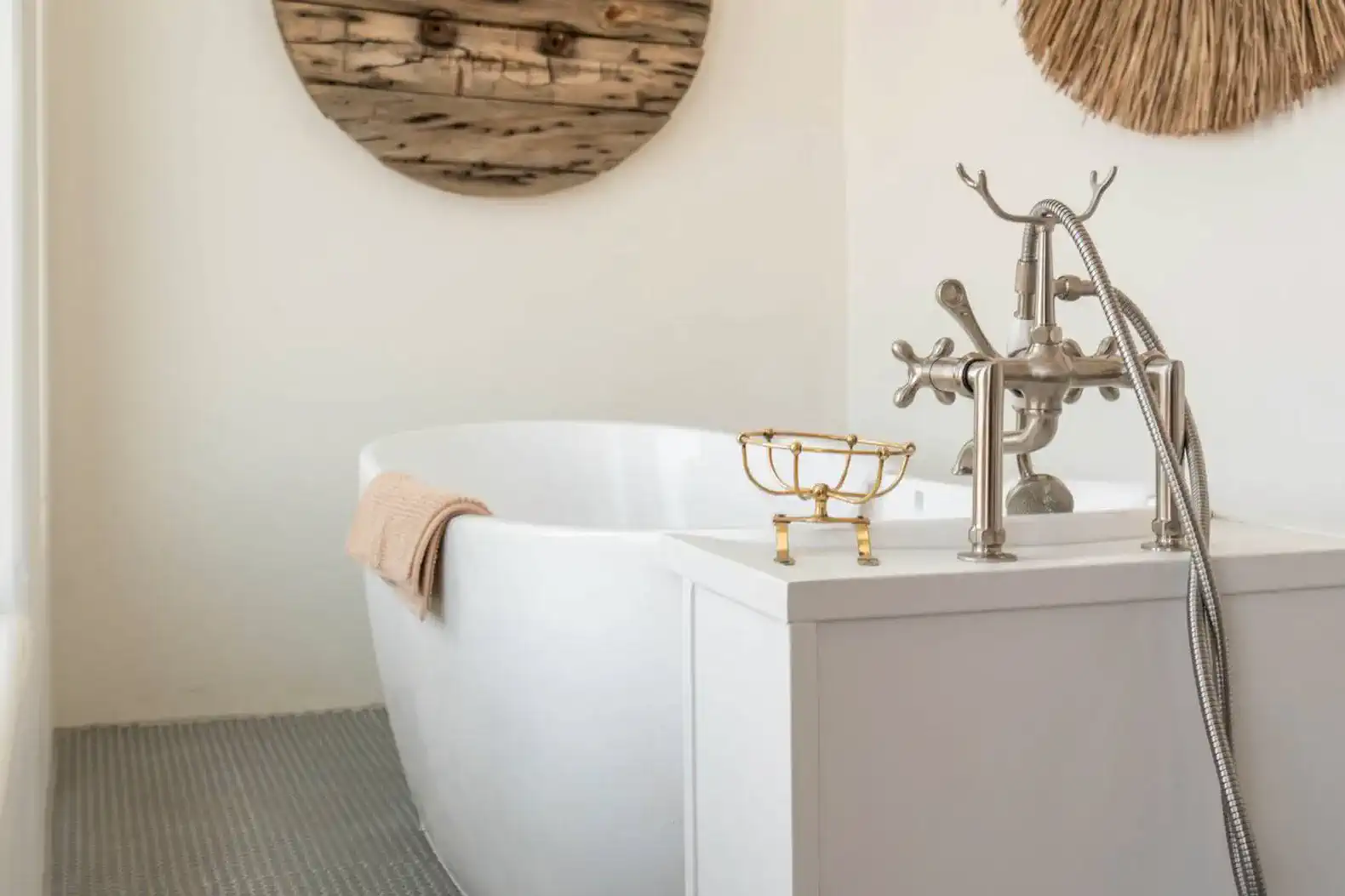 Elegant freestanding bathtub with decorative accents and modern fixtures