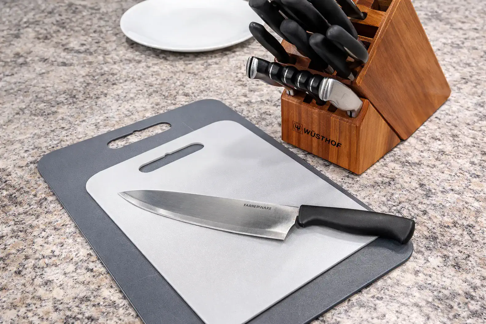 A sharp chef’s knife and cutting boards are provided for effortless meal preparation at home.