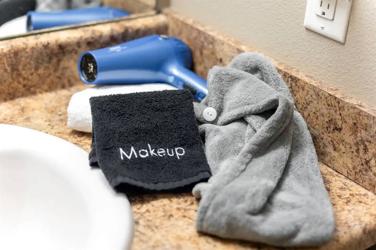 Thoughtful bathroom extras included — makeup removal towels, a hair wrap, and a hair dryer to make getting ready easy and stress-free during your stay.