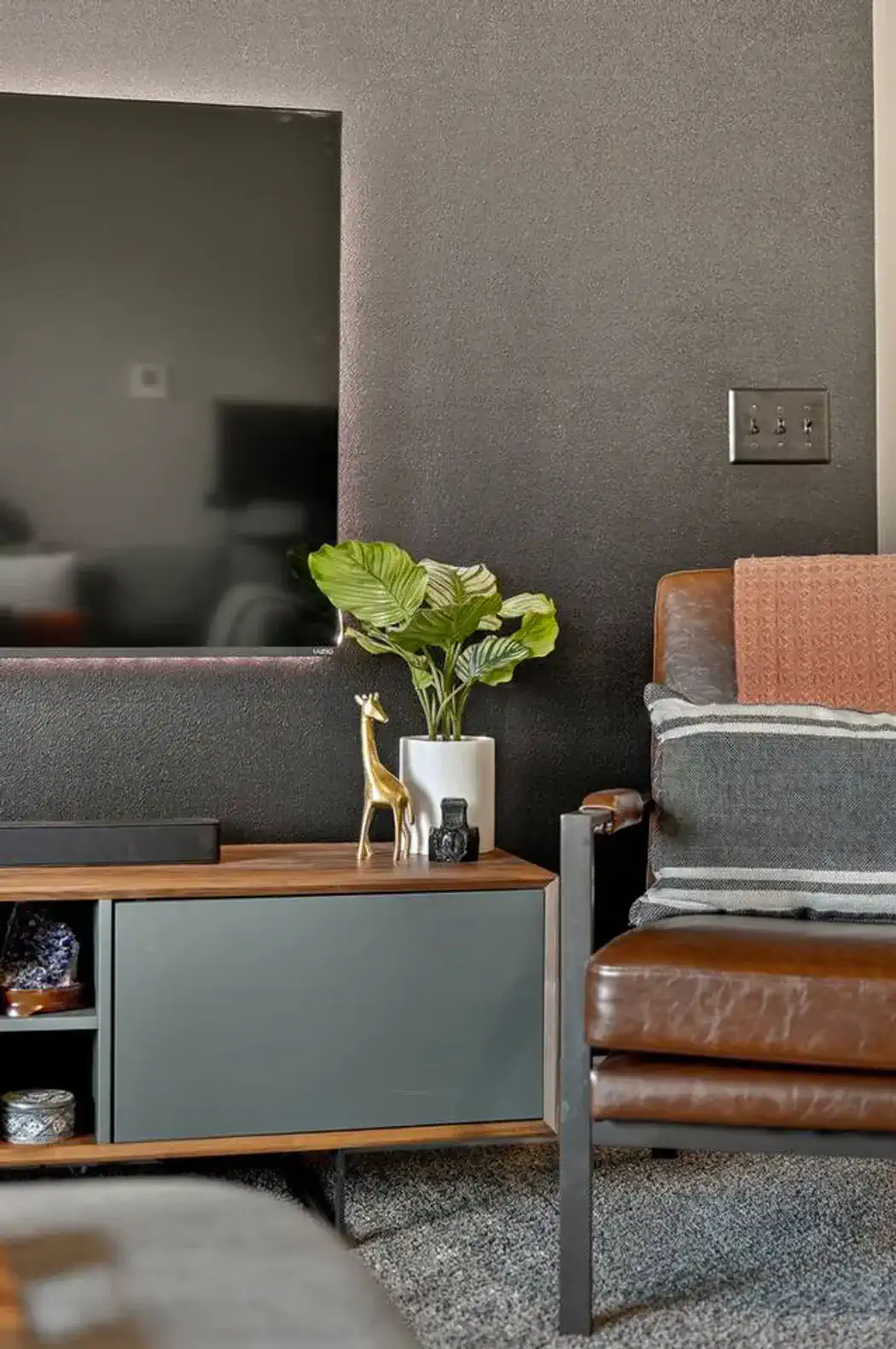 Minimalist design with art, plant décor, and stylish accents.