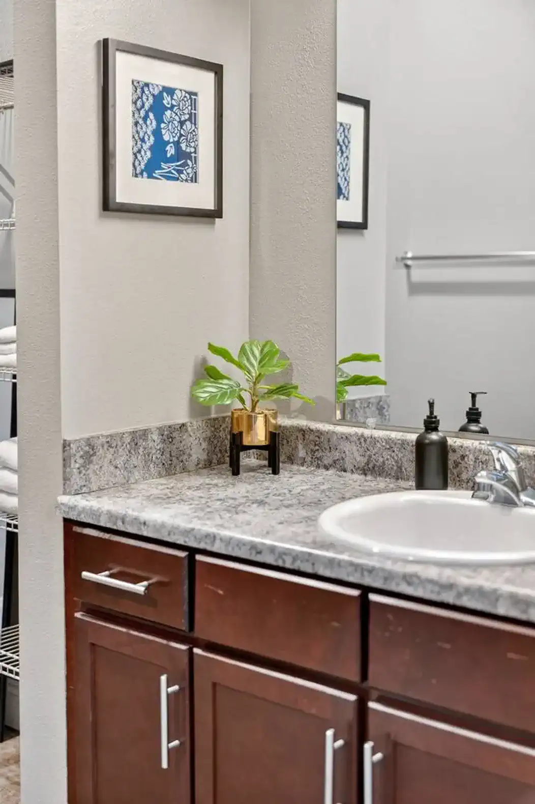 The primary bathroom has plenty of storage in the vanity; use the drawers or cabinets.