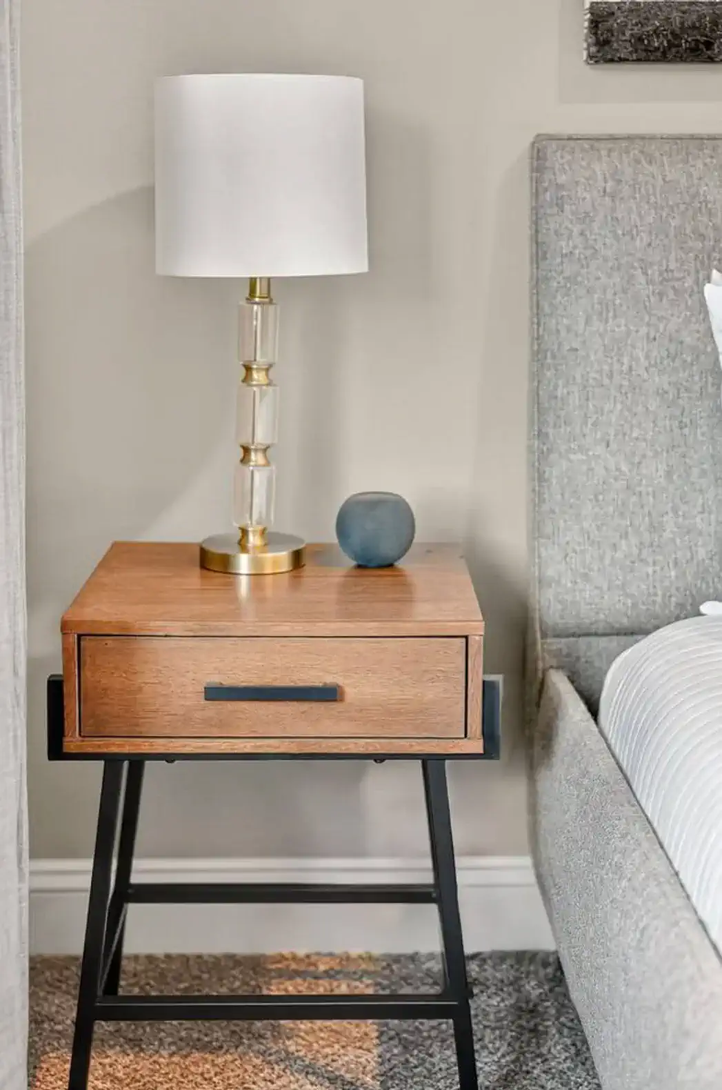 Simple décor and soft lighting for a relaxing bedroom retreat.