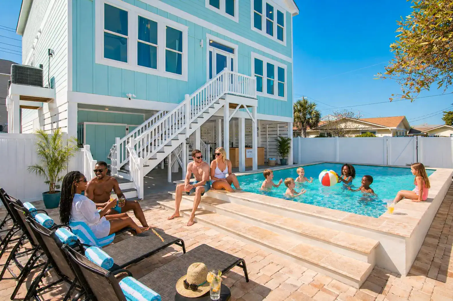 Outdoor pool area with guests enjoying the sun and swimming