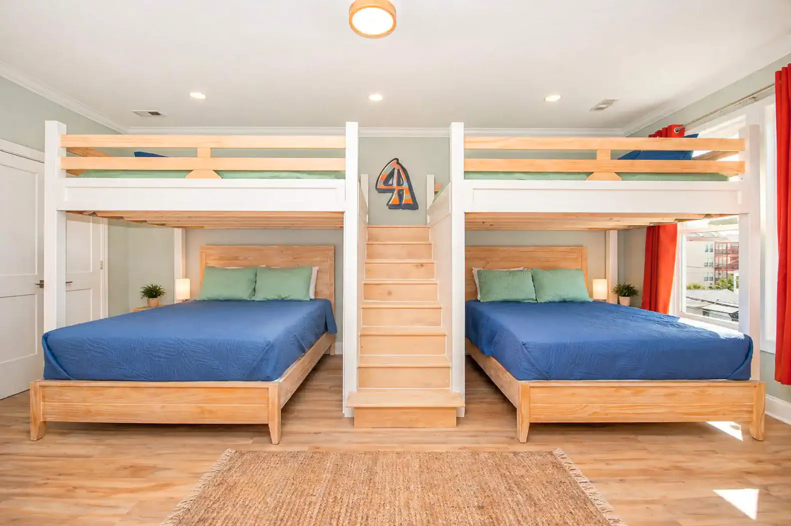 Upper-Level Bunkroom.  Four Queen Beds make the space flexible for all guests