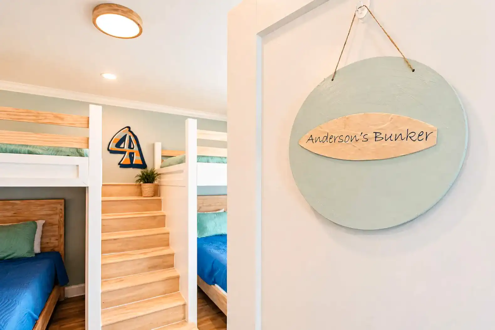 Anderson's Bunker-Dedicated to local surfer Anderson Estep.  This bunk room has a total of four queen beds.  It has a large Walk-In closet and attached En Suite with double vanity and shower/tub combo.  This bedroom is located on the upper level.  