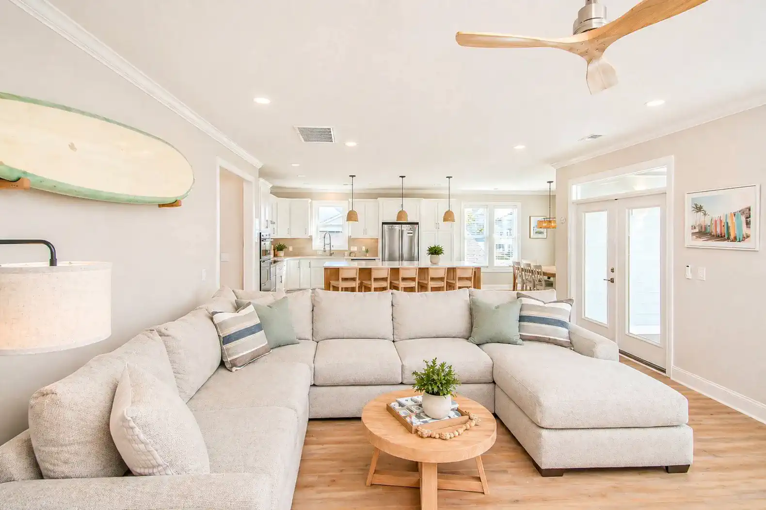 Spacious living room with sectional sofa and open kitchen view