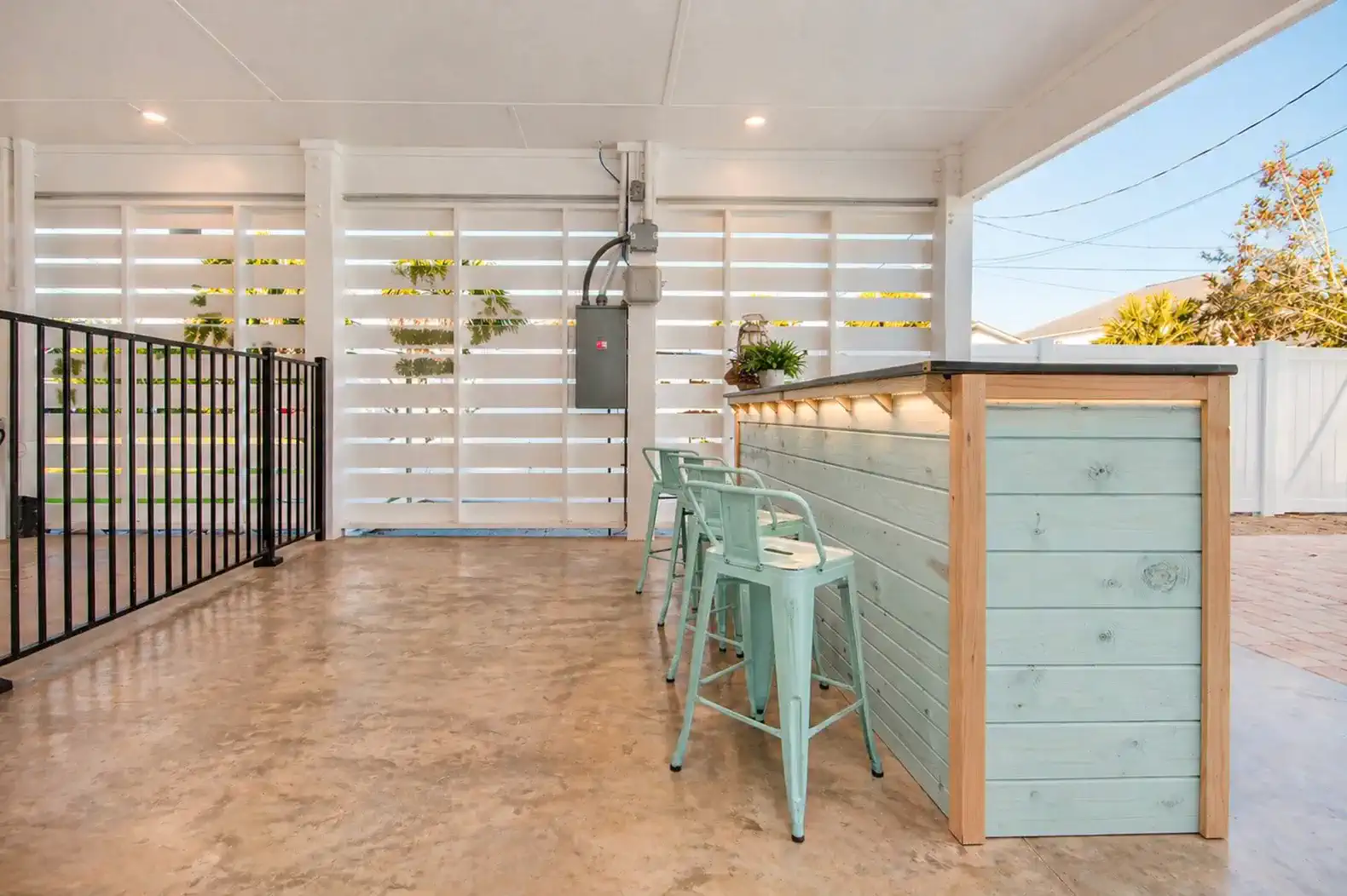 Outdoor bar area with seating and modern design