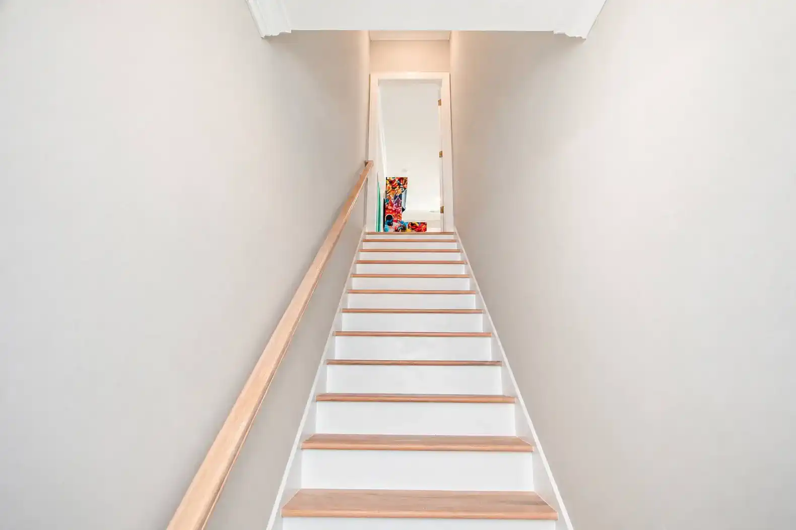 Stairwell to Upper Level.  There is a door/lock at the top of the stairs
