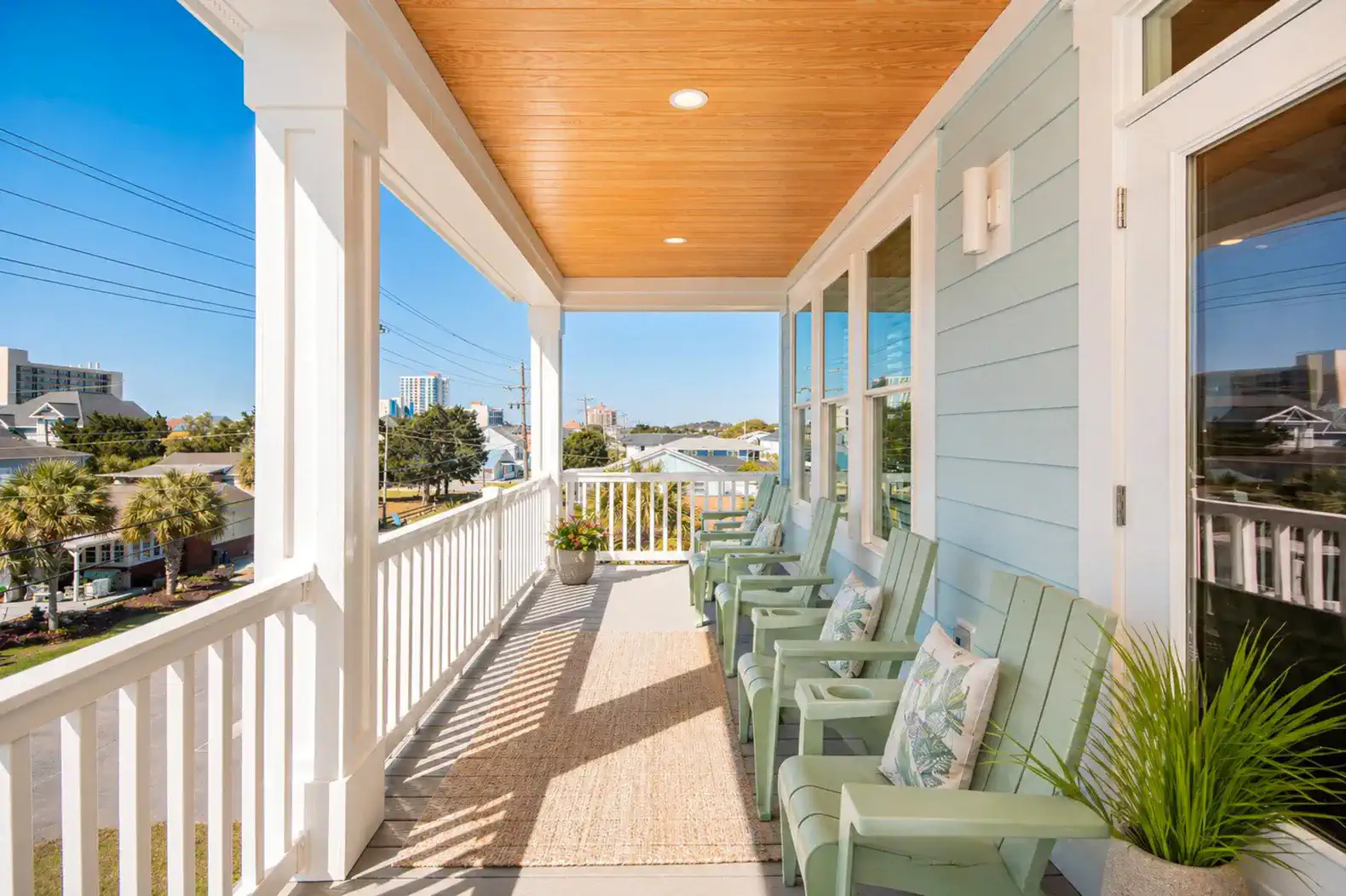 Spacious balcony with seating and views of the surrounding area