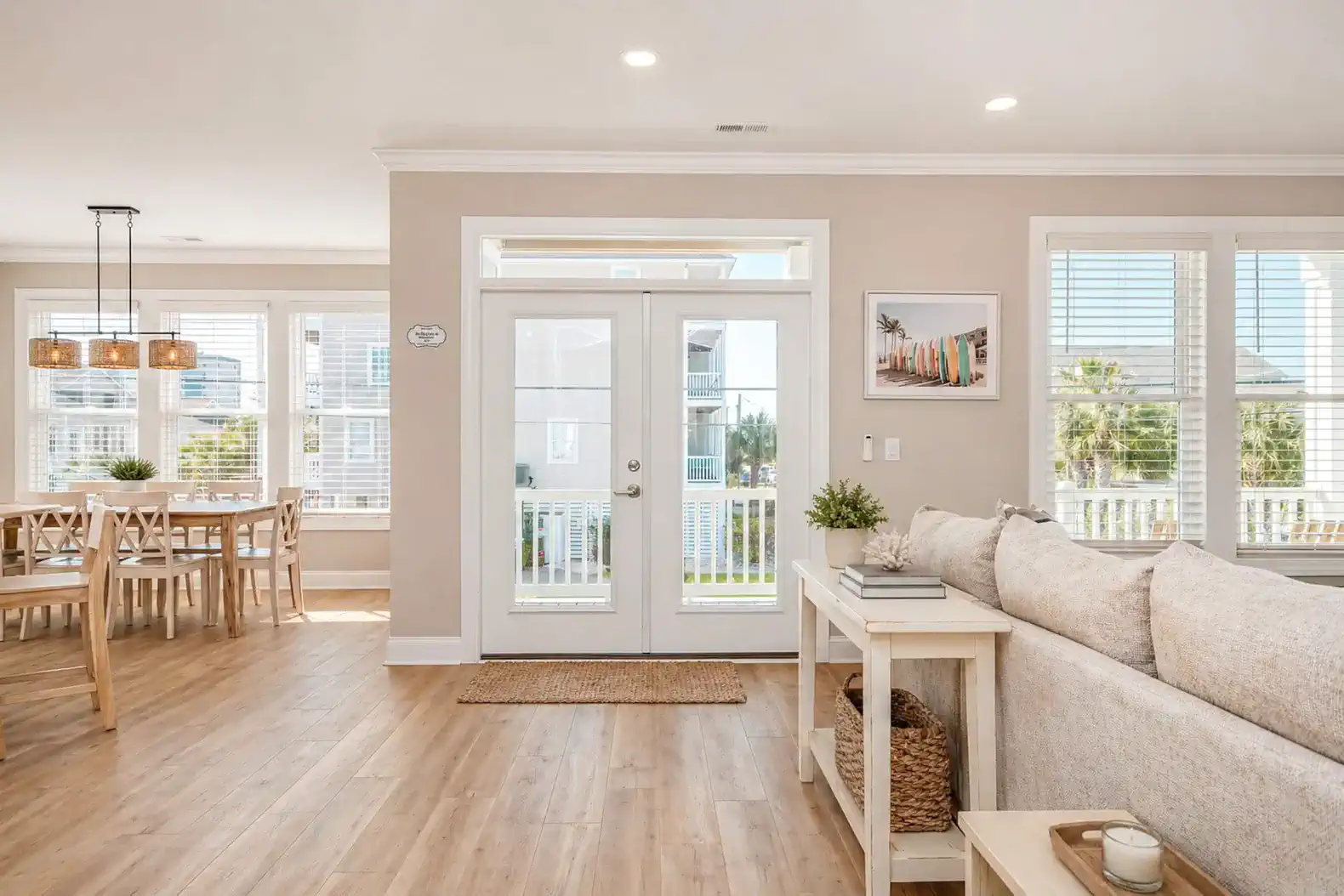 Bright living area with access to outdoor space and dining area in view