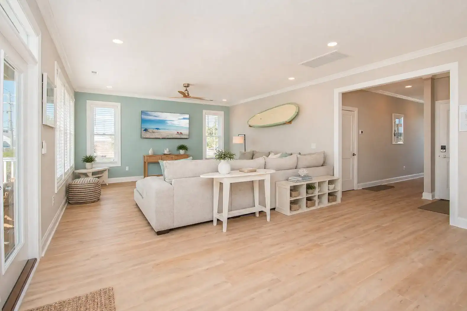 Bright and airy living room with comfortable seating and coastal decor