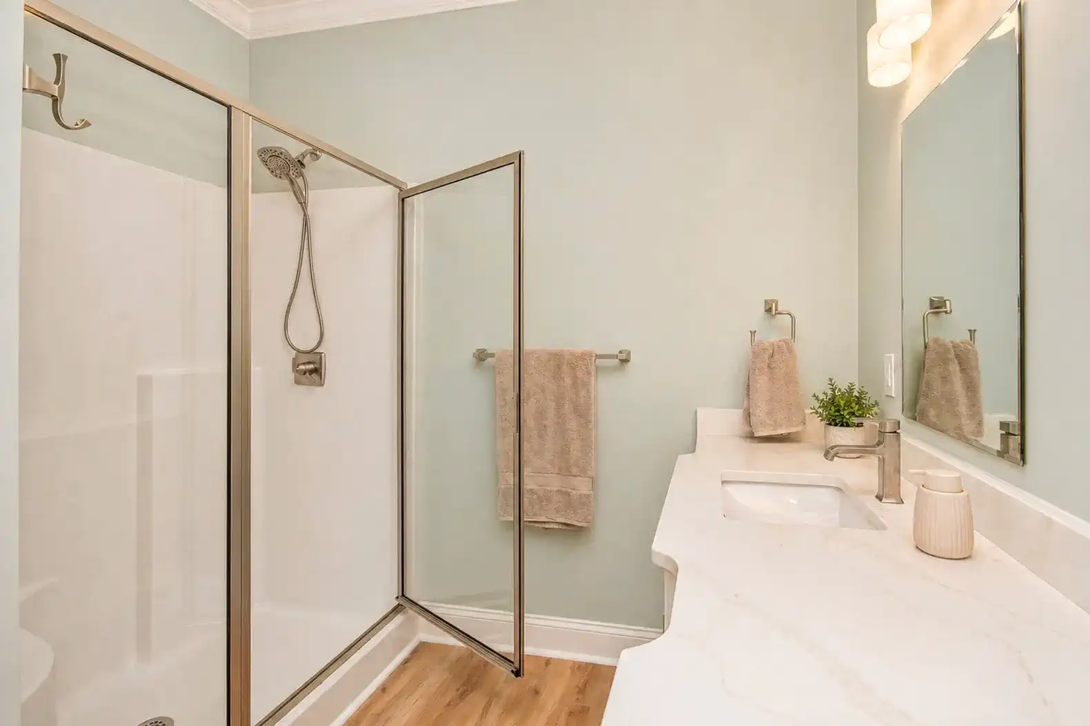 Modern bathroom featuring a glass shower and elegant countertop