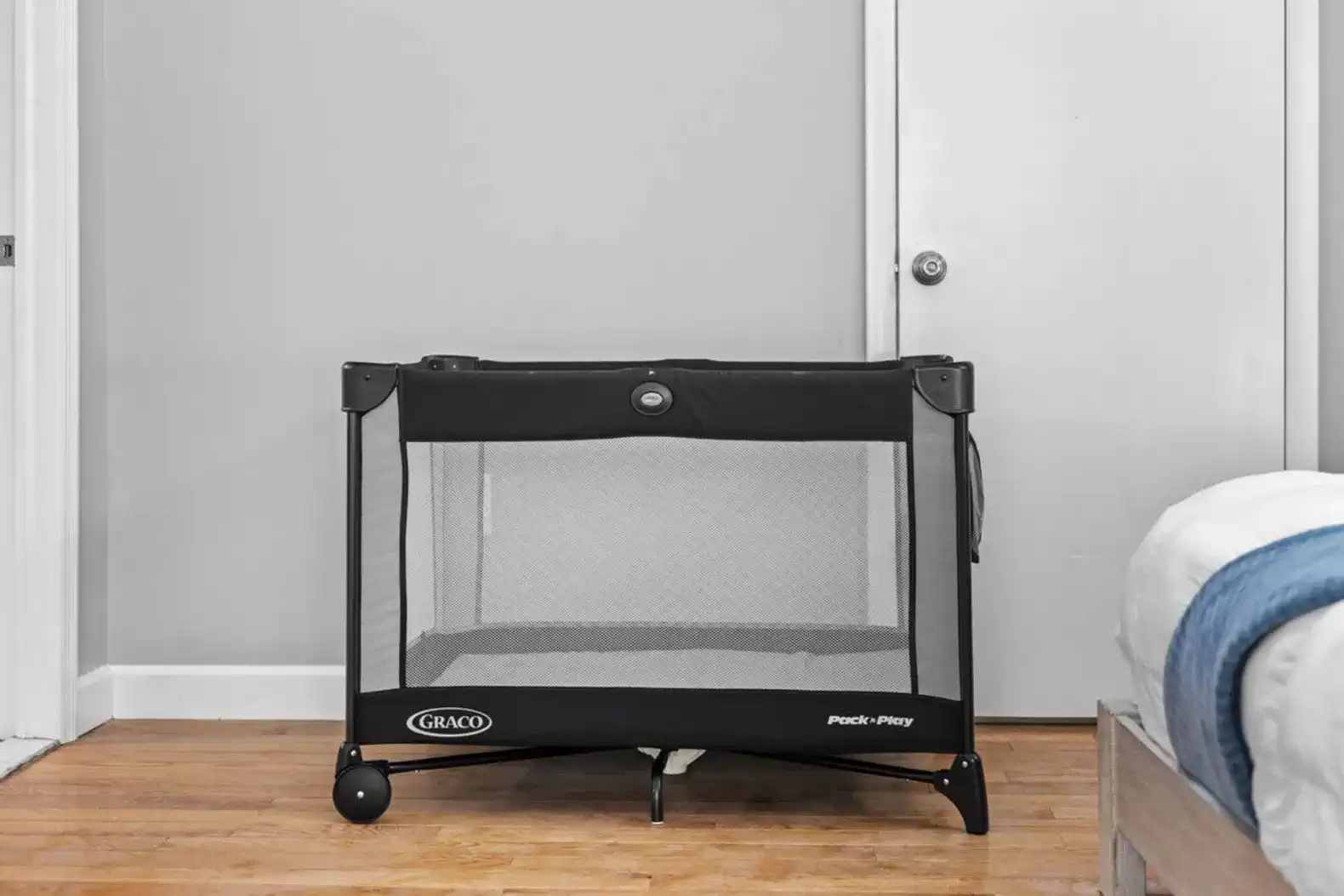 Family-friendly bedroom equipped with a Graco Pack ’n Play for your little one's comfort and safety