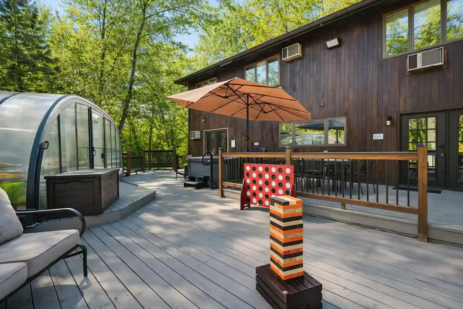 Spacious deck with hot tub, grill, games & forest views