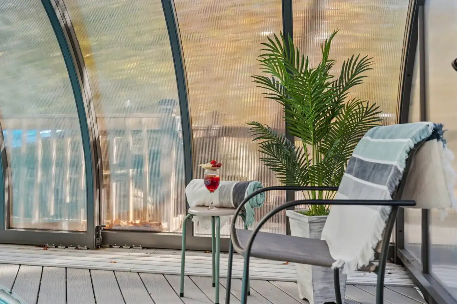 Relax in the climate-controlled pool enclosure surrounded by lush forest views