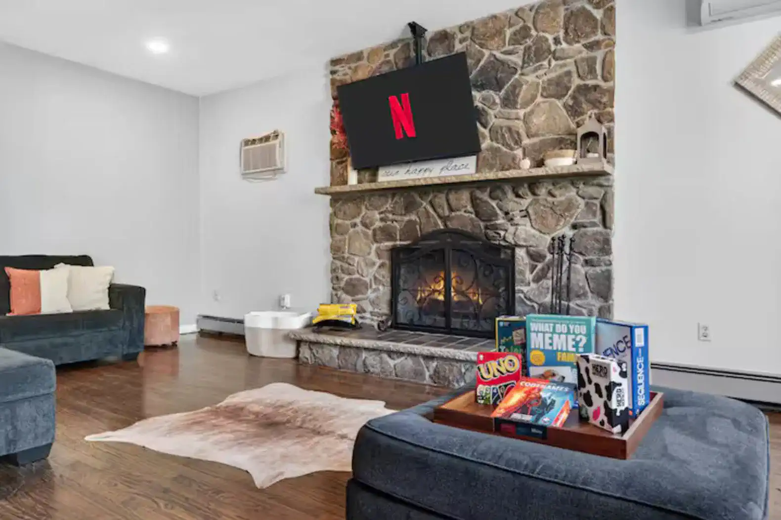 Cozy lounge with stone fireplace, Netflix-ready TV & board games