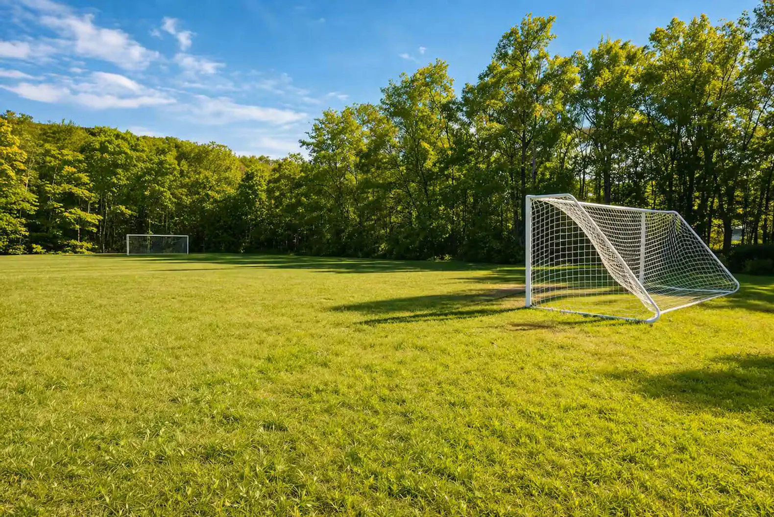 Nearby soccer field and open green space for recreation and relaxation