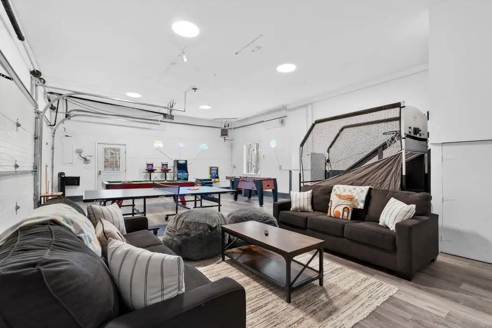 Spacious game room arcade, ping-pong, hoops, foosball + comfy lounge