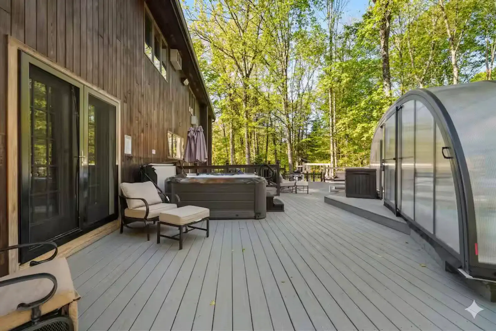 Private hot tub area with plush seating, perfect for relaxing after a day of adventure