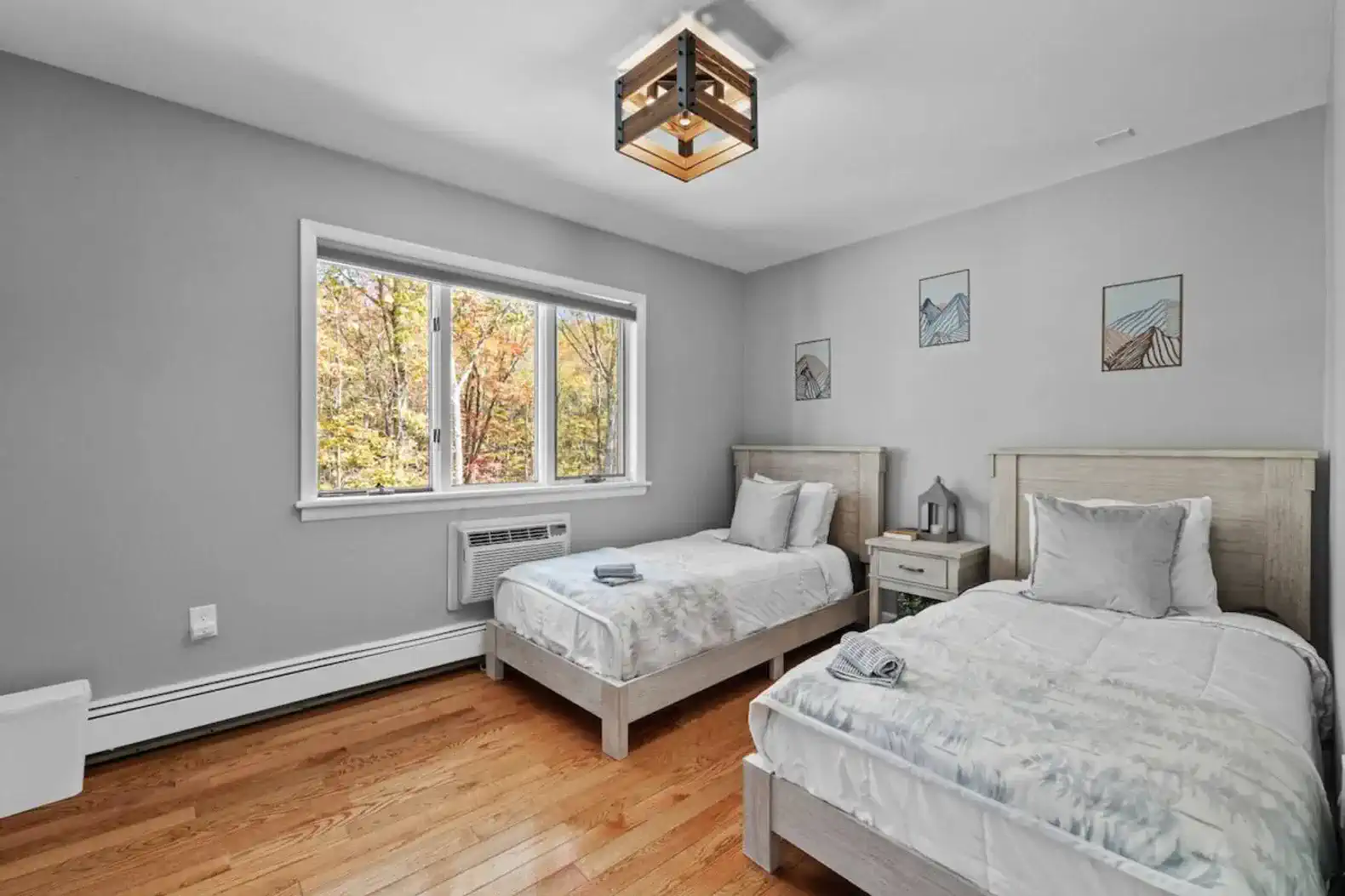 Bright and cozy bedroom with two twin beds, perfect for friends or kids.