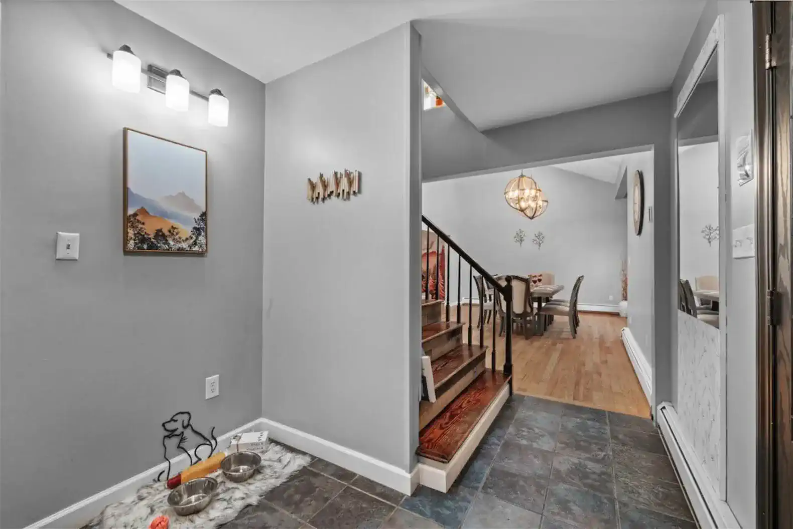Welcoming foyer with decorative elements and access to the dining area