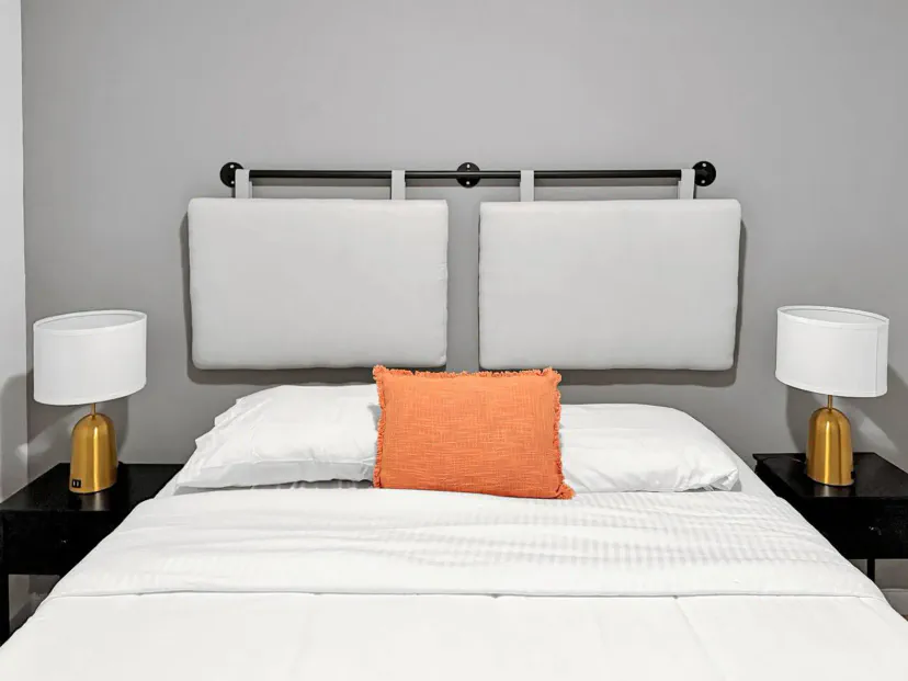 Cozy master bedroom with modern decor and stylish lamps