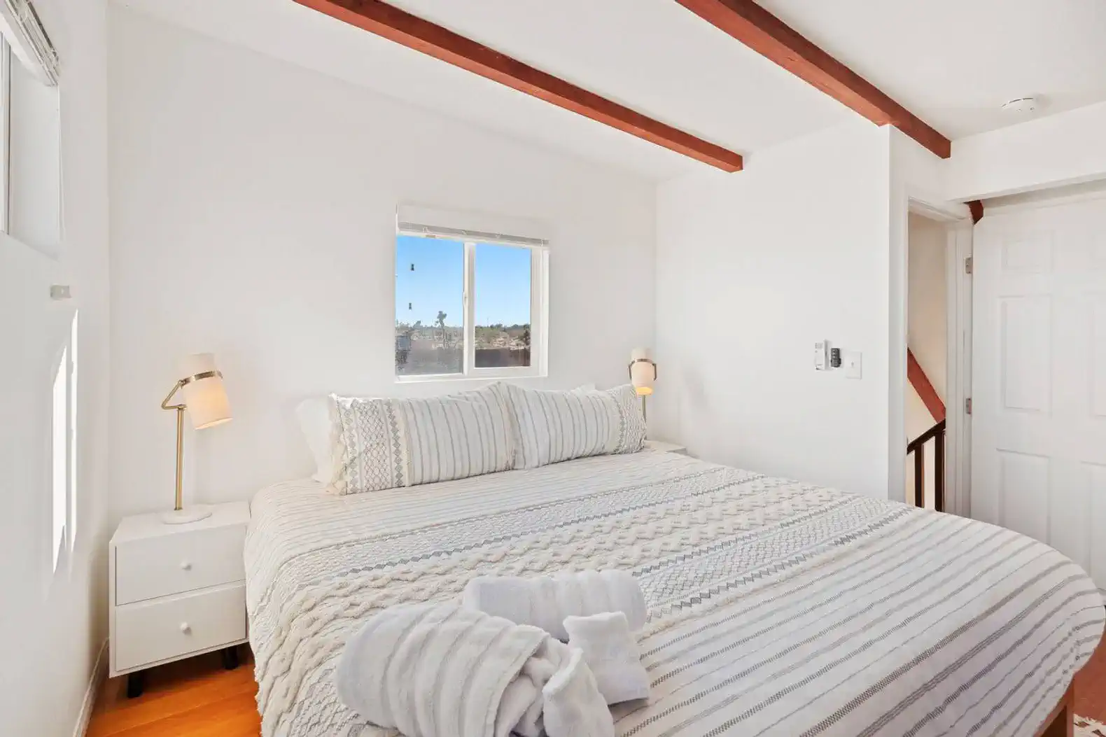 Cozy master bedroom with a large bed and natural light