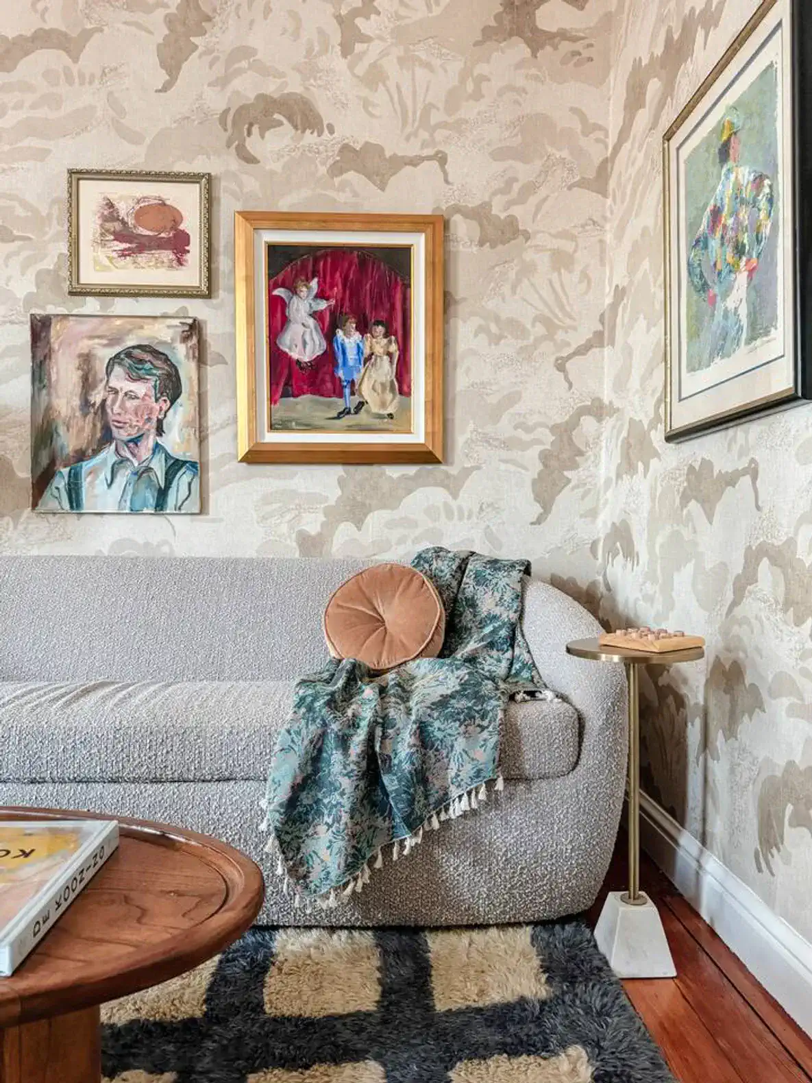 Cozy living room with artistic wall decor and a comfortable sofa