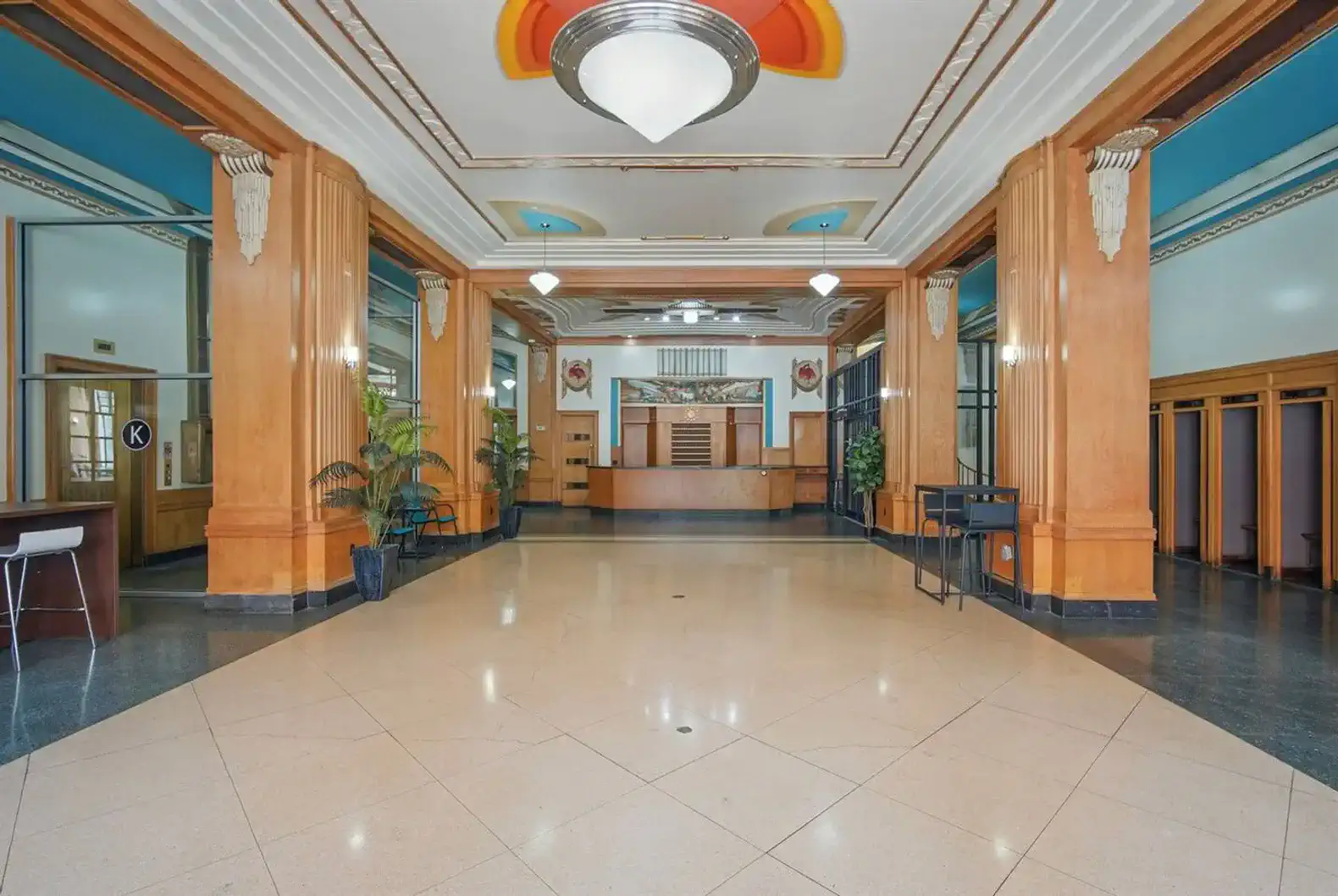 Enjoy the open and airy lobby space featuring soaring ceilings, historic accents, and mid-century design touches.