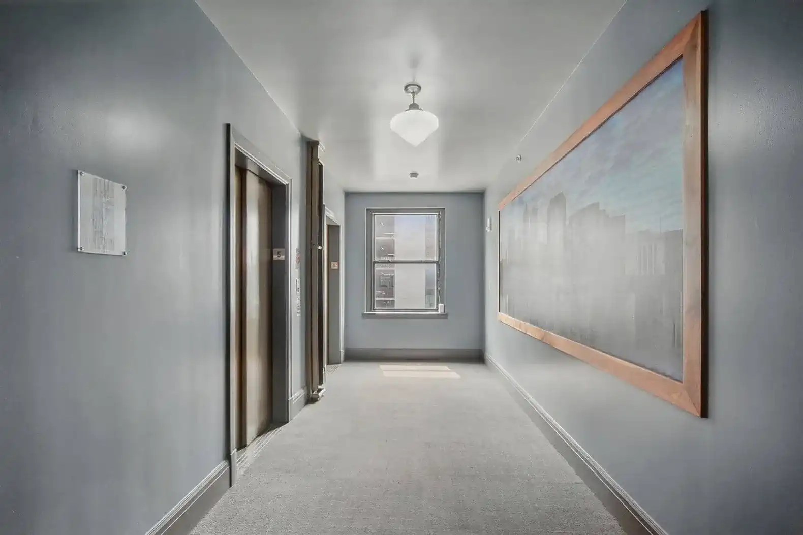 Bright, clean, and quiet—hallways feature natural light and artwork celebrating downtown Des Moines.